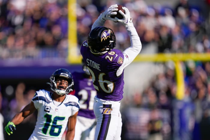 Baltimore Ravens safety Geno Stone (26) catches an interception against the Seattle Seahawks during the first half at M&T Bank Stadium.